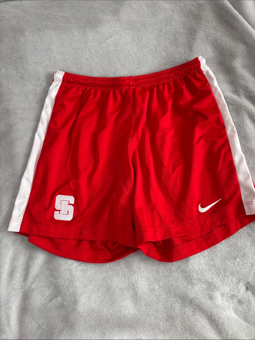 Nike Women's Red Athletic Shorts with White Side Stripes